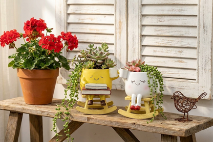 Happy Rocking Planter — both variants on rustic bench